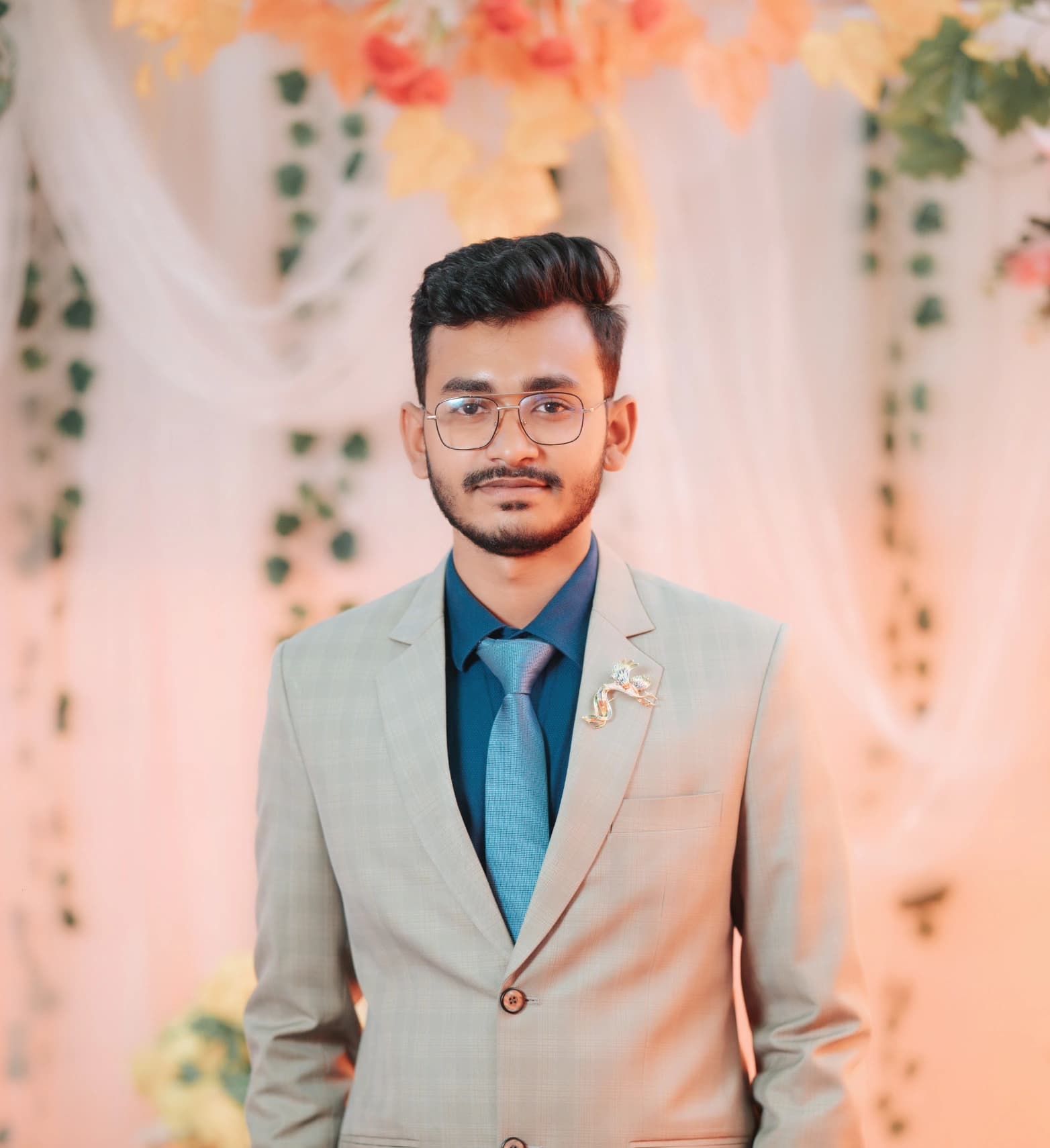 Fahim Faisal Tarun, social media marketer and founder of BrandEzzy, in a light suit and glasses